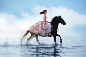 Motto-Ziele Bild Pferd mit Reiterin im Meer